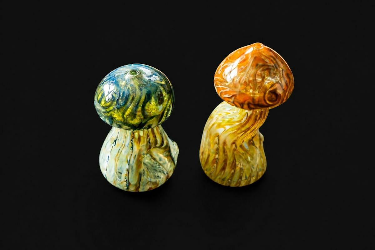 Two hand-made glass mushrooms by Homie B Glass